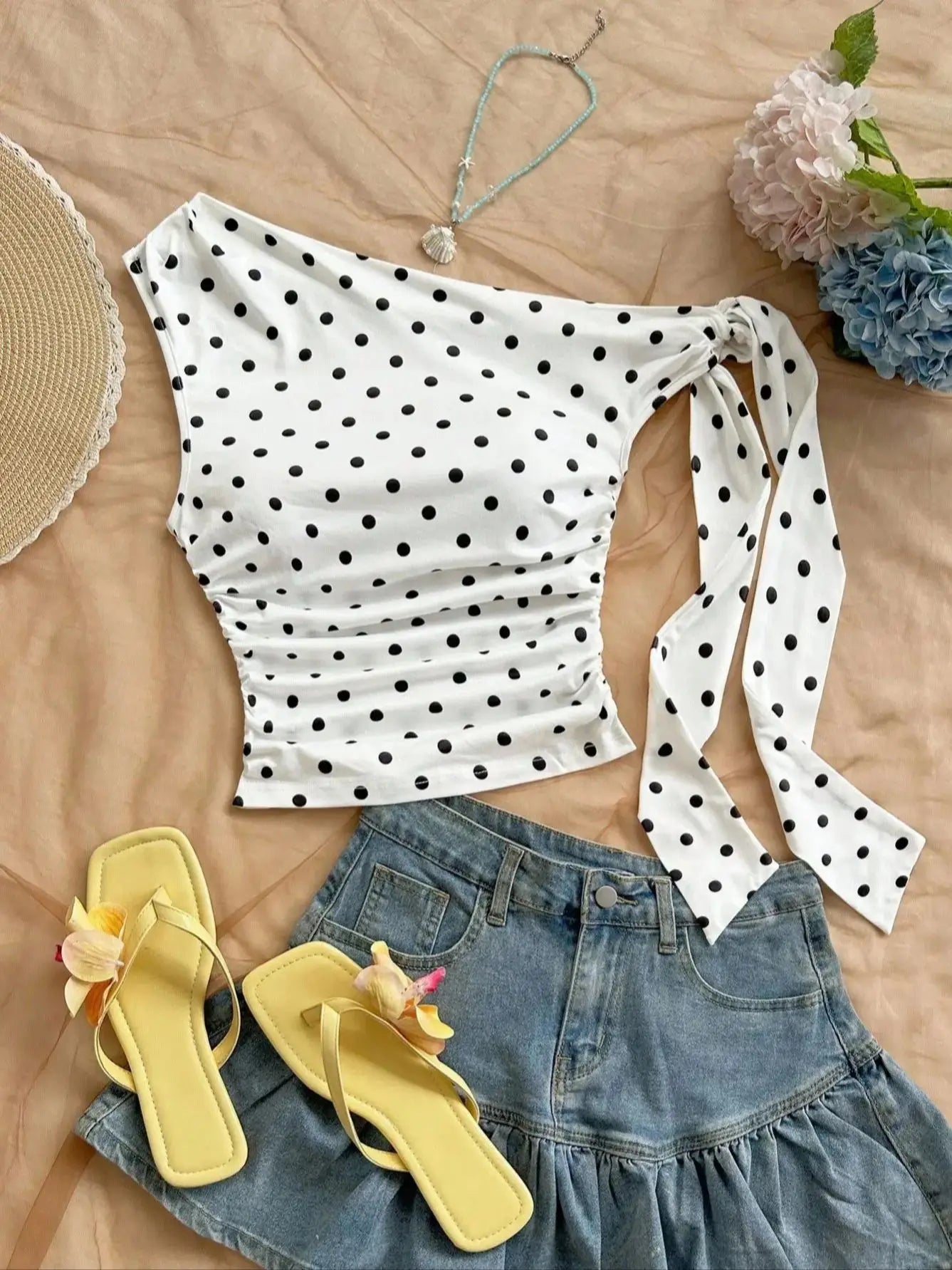 Top asymétrique à pois