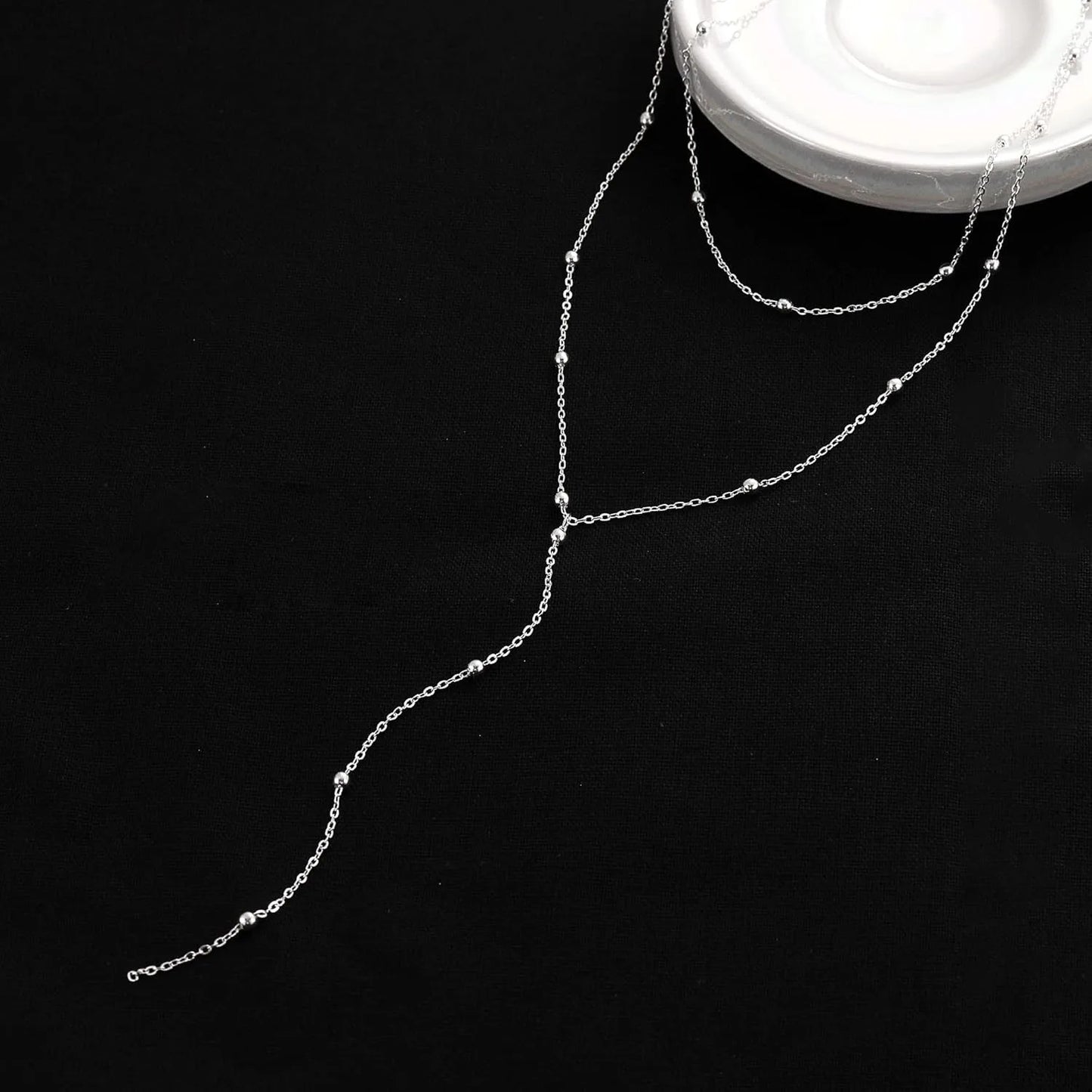 Collier long à breloques