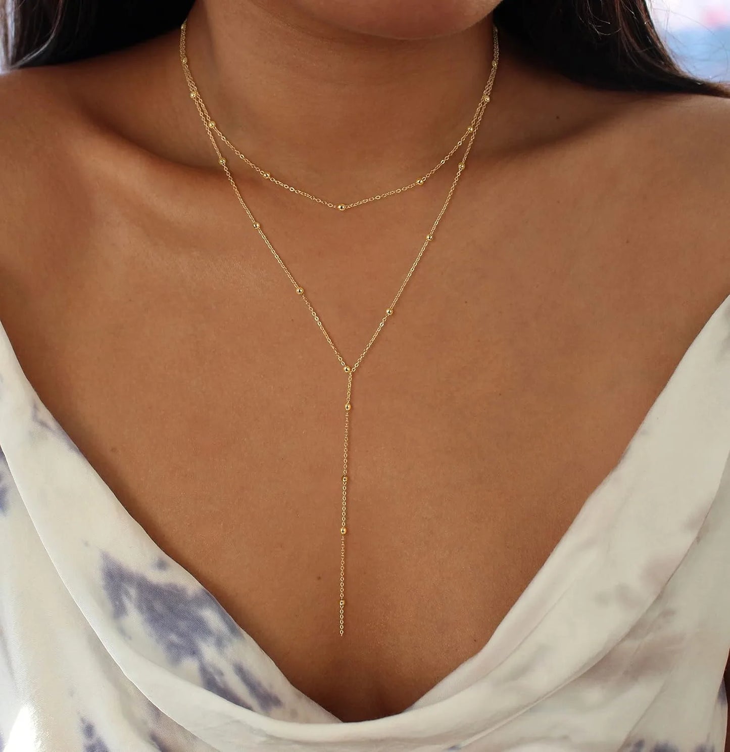 Collier long à breloques